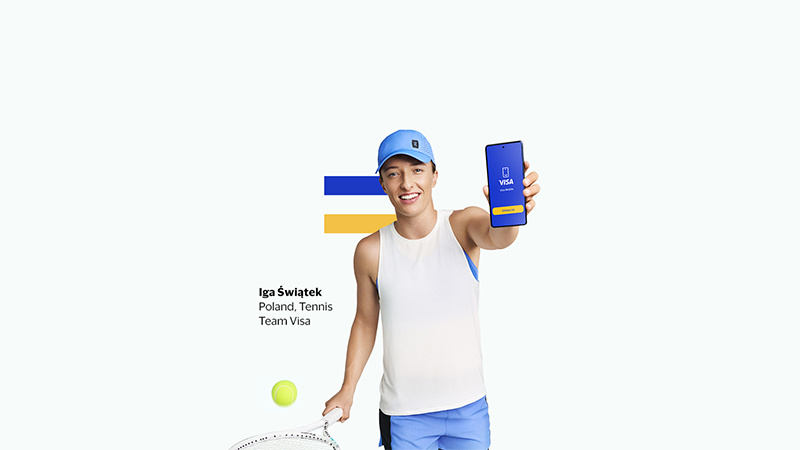 Woman smiling and holding tennis racquet