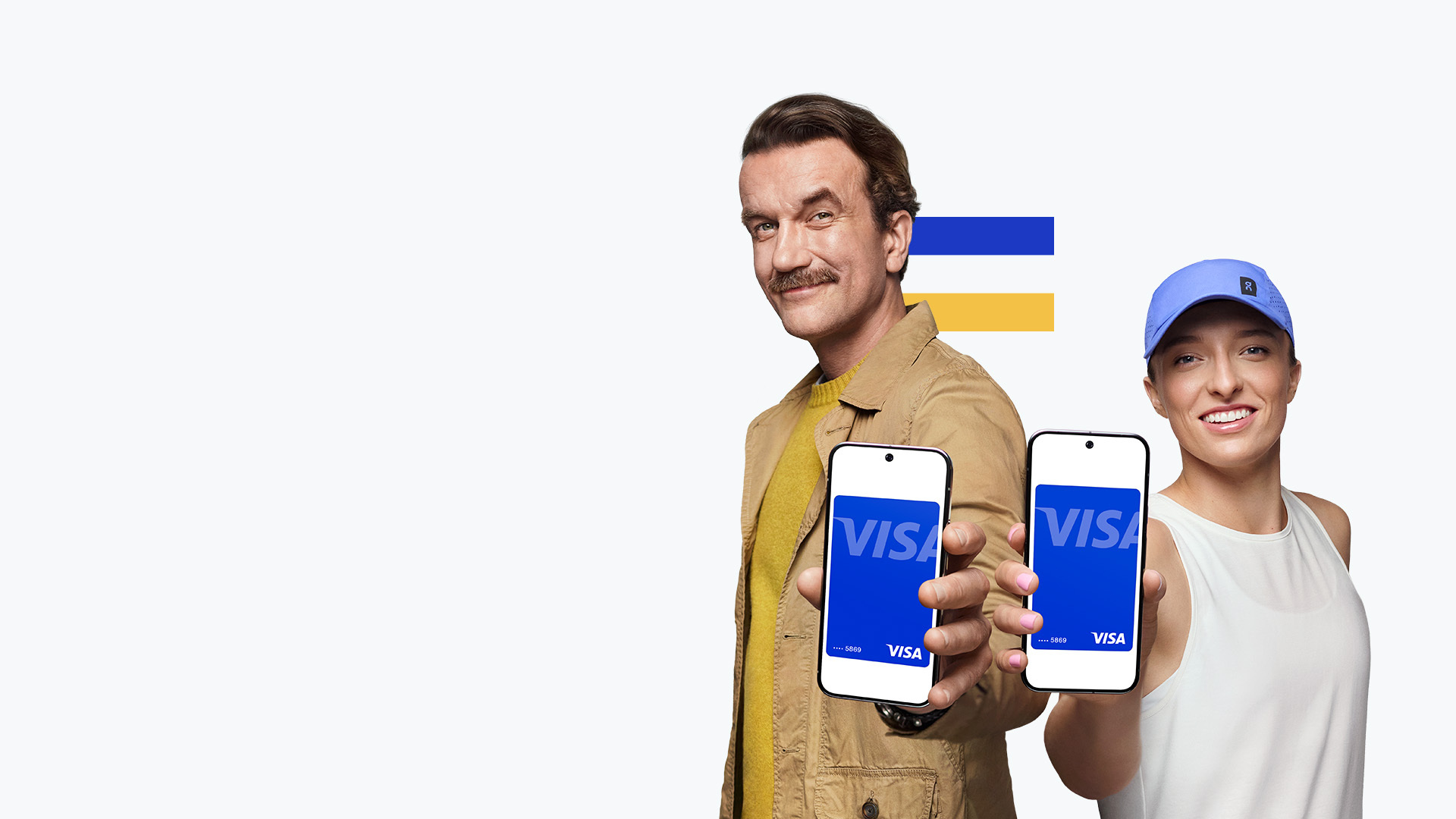 man and woman holding mobile with visa card