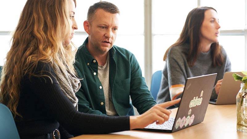 Chime employees collaborating in a meeting.