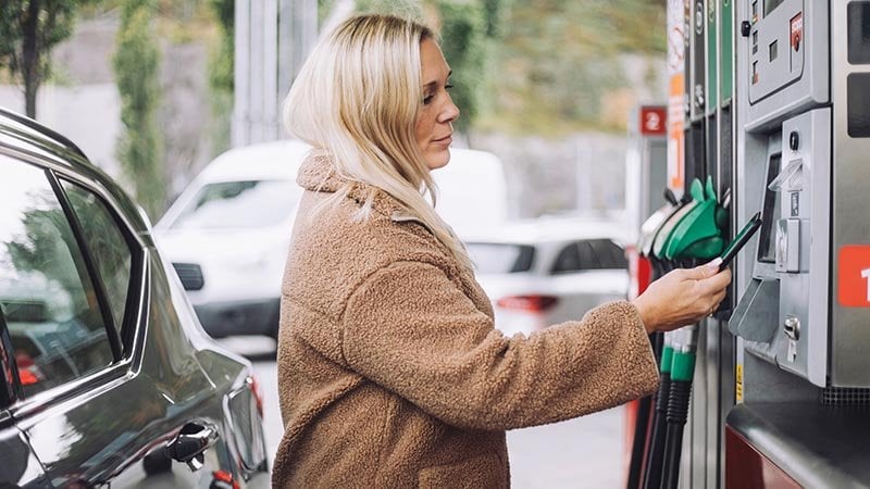 woman paying for fuel